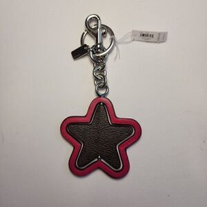 NWT Coach CP899 Spinning Star Bag Charm In Signature Canvas Bright Violet